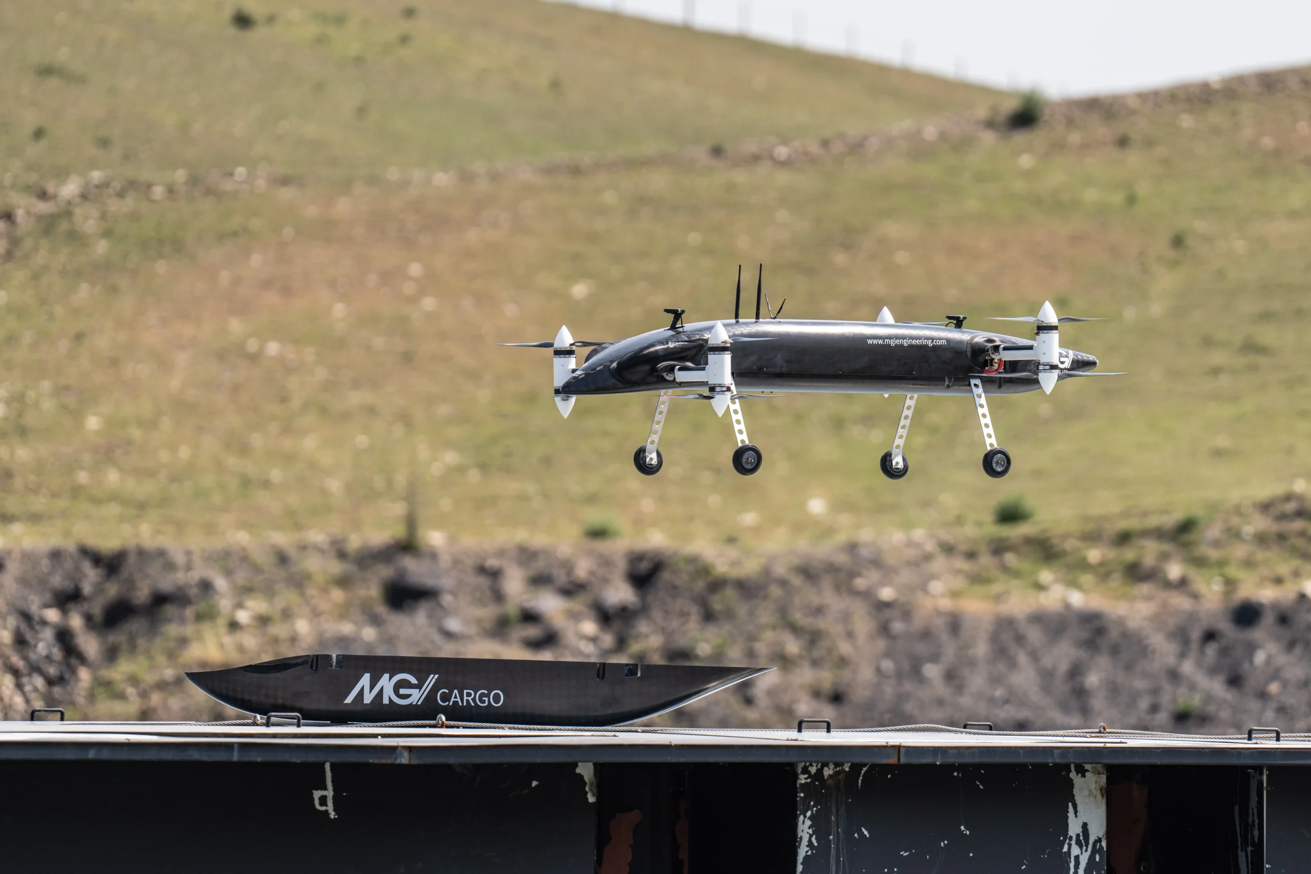 MGI Mosquito drone delivering cargo module mid-mission – modular eVTOL UAV with vertical landing capability