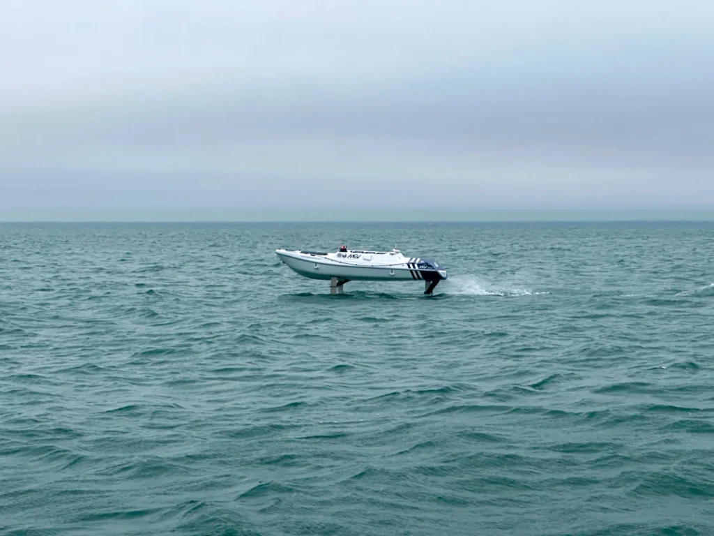 SeaGlide autonomous surface vessel travelling across open ocean during sea trials