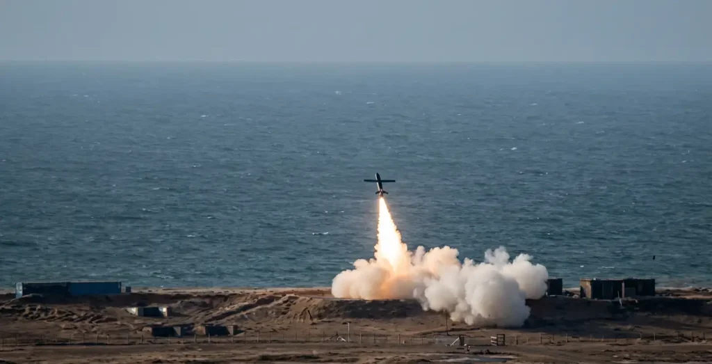 TigerShark autonomous one-way effector drone ascending after launch over coastal test range