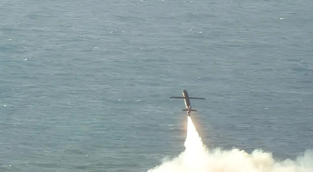 Autonomous TigerShark drone launching over water with rocket-assisted take-off plume
