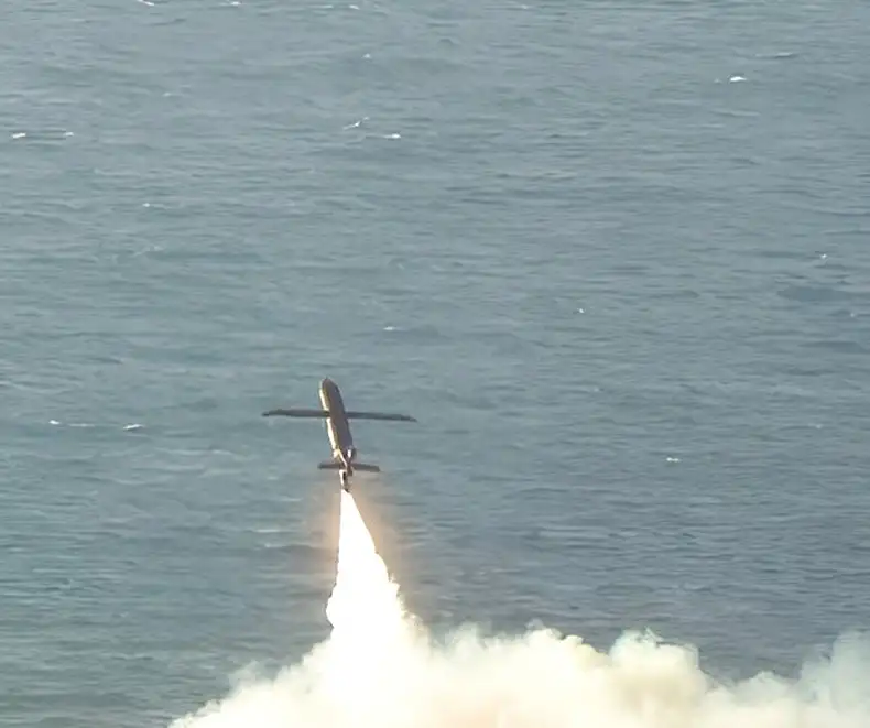Autonomous TigerShark drone launching over water with rocket-assisted take-off plume